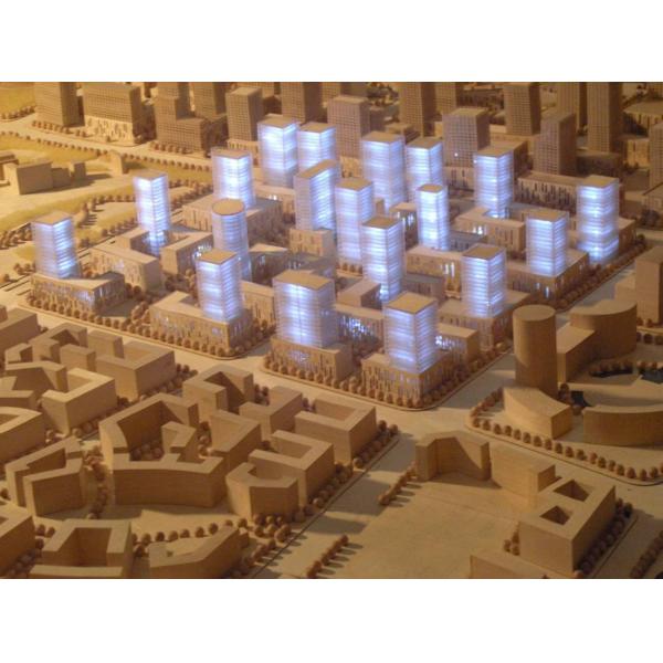Architectural Model of a Modern Urban Complex with Illuminated Buildings and Landscaped Features