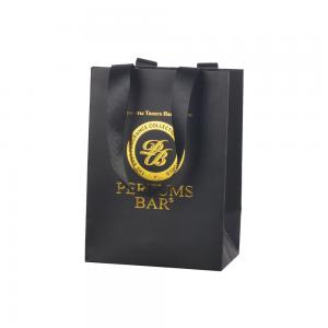 China Gold Stamping Black Paper Bags Shopping Packaging With Ribbon Handle on sale