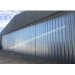China Stable Triangular Seal Vertical Hinged Door Sectional Leaves Folding Sliding Hangar Doors for sale
